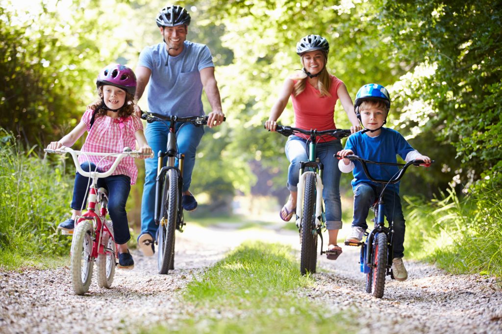 Family On Cycle Ride In Countryside outdoor activities